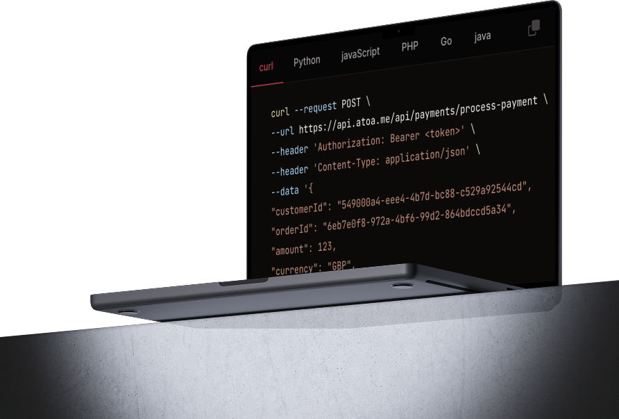 Atoa payment API code sample shown on a laptop