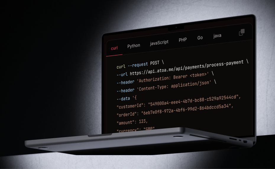 Atoa payments API code sample shown on a laptop